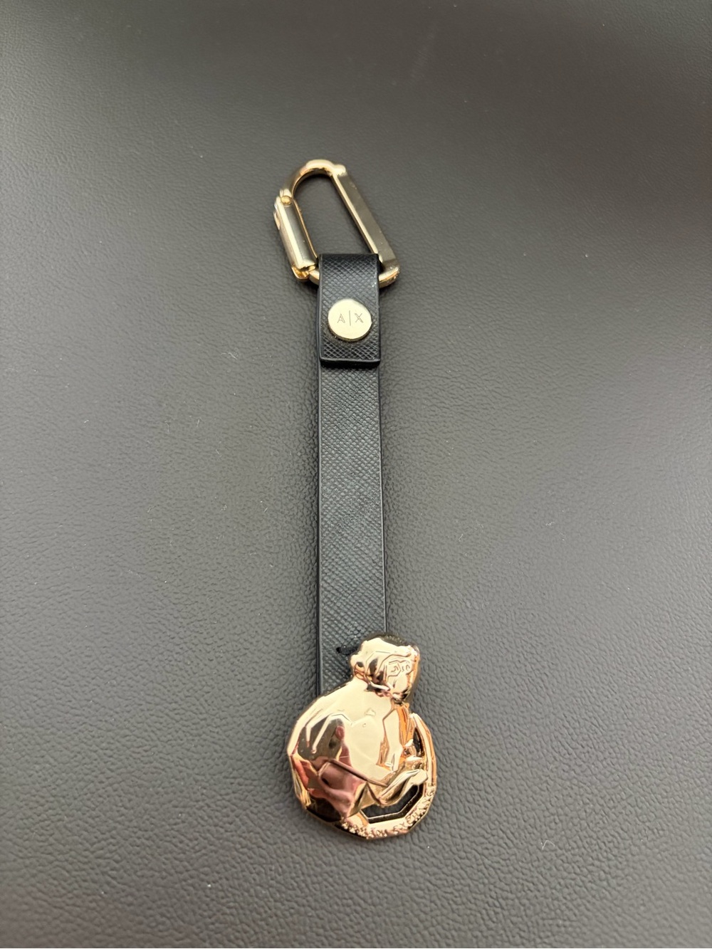 Black Armani Exchange Leather Strap Keychain with Gold Monkey Medallion